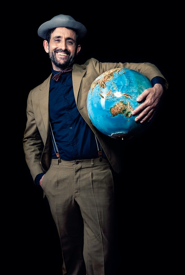 happy man holding a globe