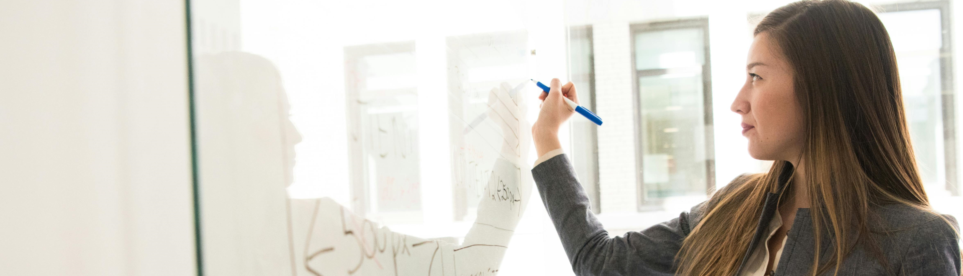 woman at white board