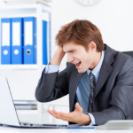 frustrated user at a laptop