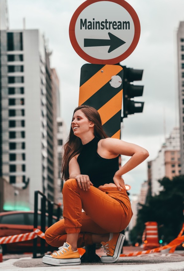 sitting in front of a traffic sign